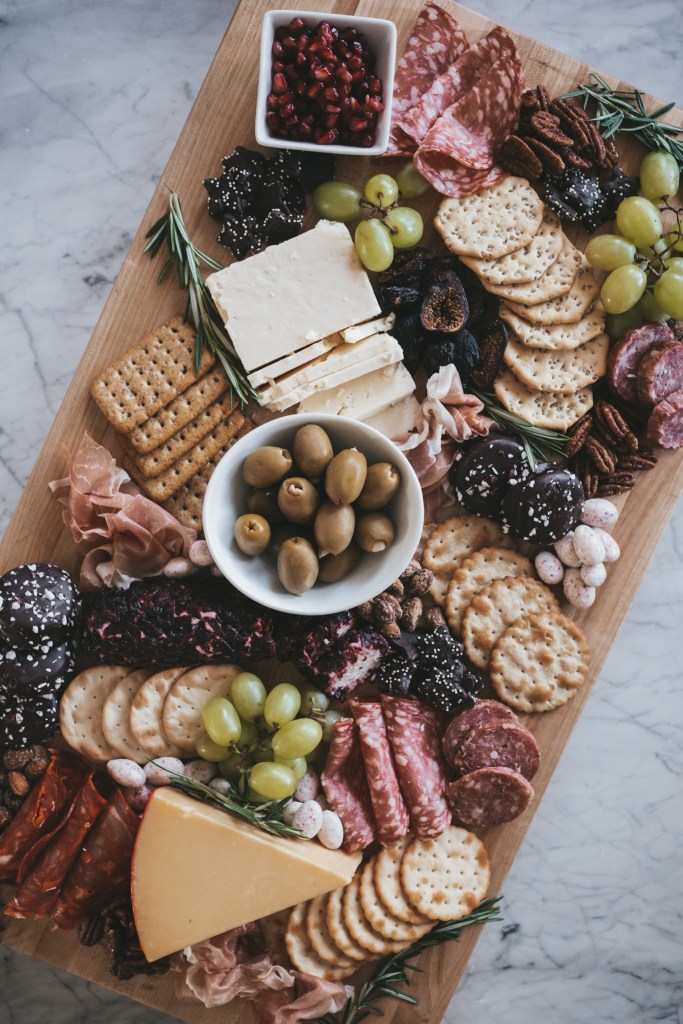 a charcuterie board with food items from Trader Joe's